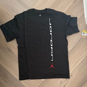 Jordan Men’s Black Tee with White Vertical Logo and Red Jumpman